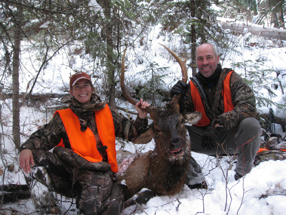 Bull Elk with happy Husband and Wife